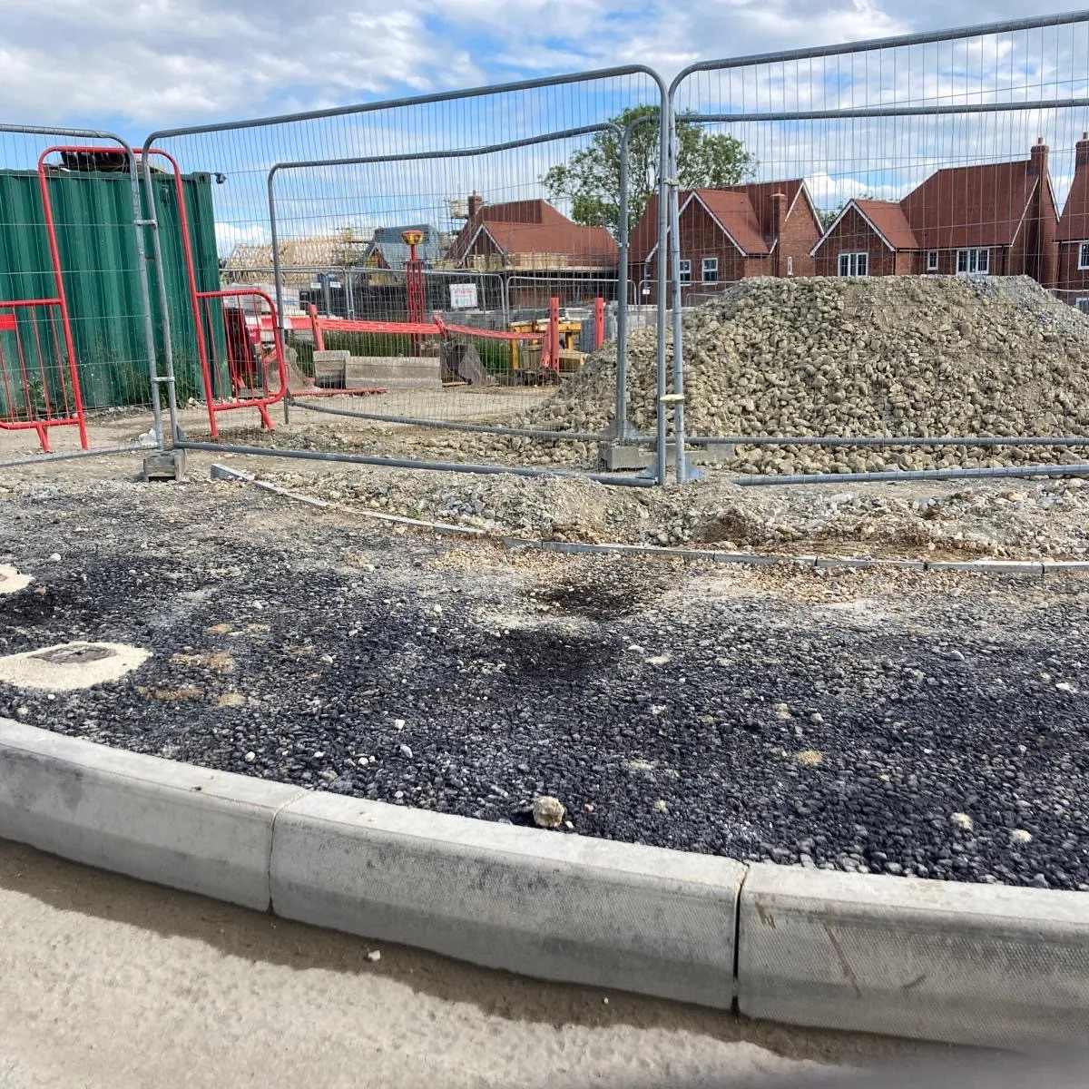 Housing development construction site with temporary heras fencing and site security