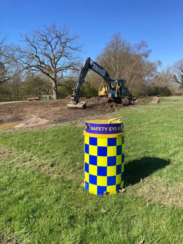 Safety Eye CCTV bollard on grass monitoring active excavation digger works