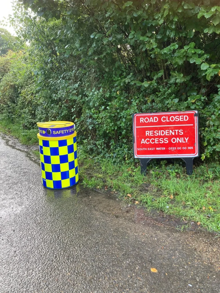 Safety Eye CCTV bollard next to road closed residents access only sign during utility works