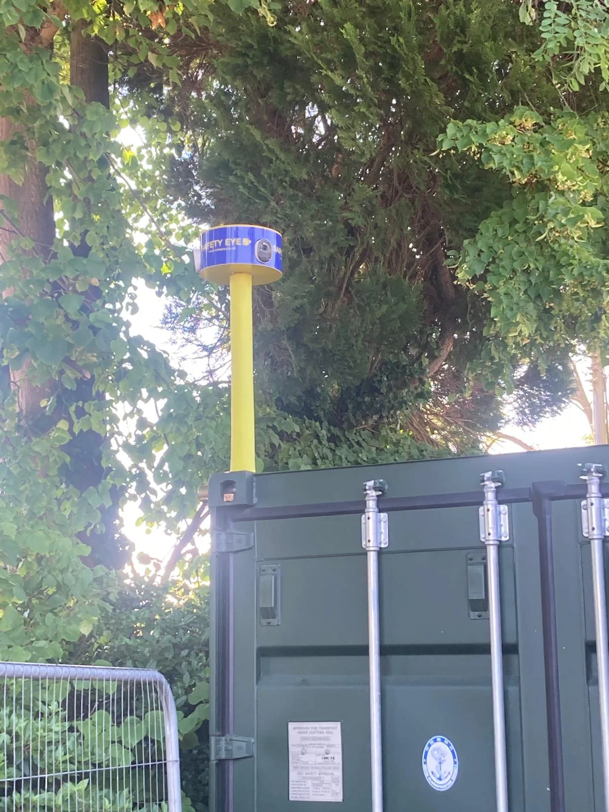 Safety Eye CCTV bollard deployed beside a shipping container for construction site security