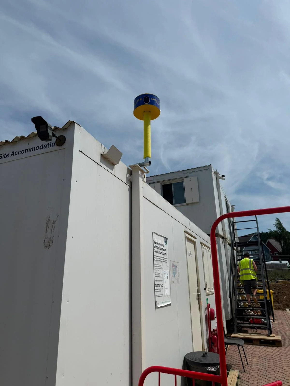 Wide view of Safety Eye CCTV bollard mounted on top of construction site accommodation cabin