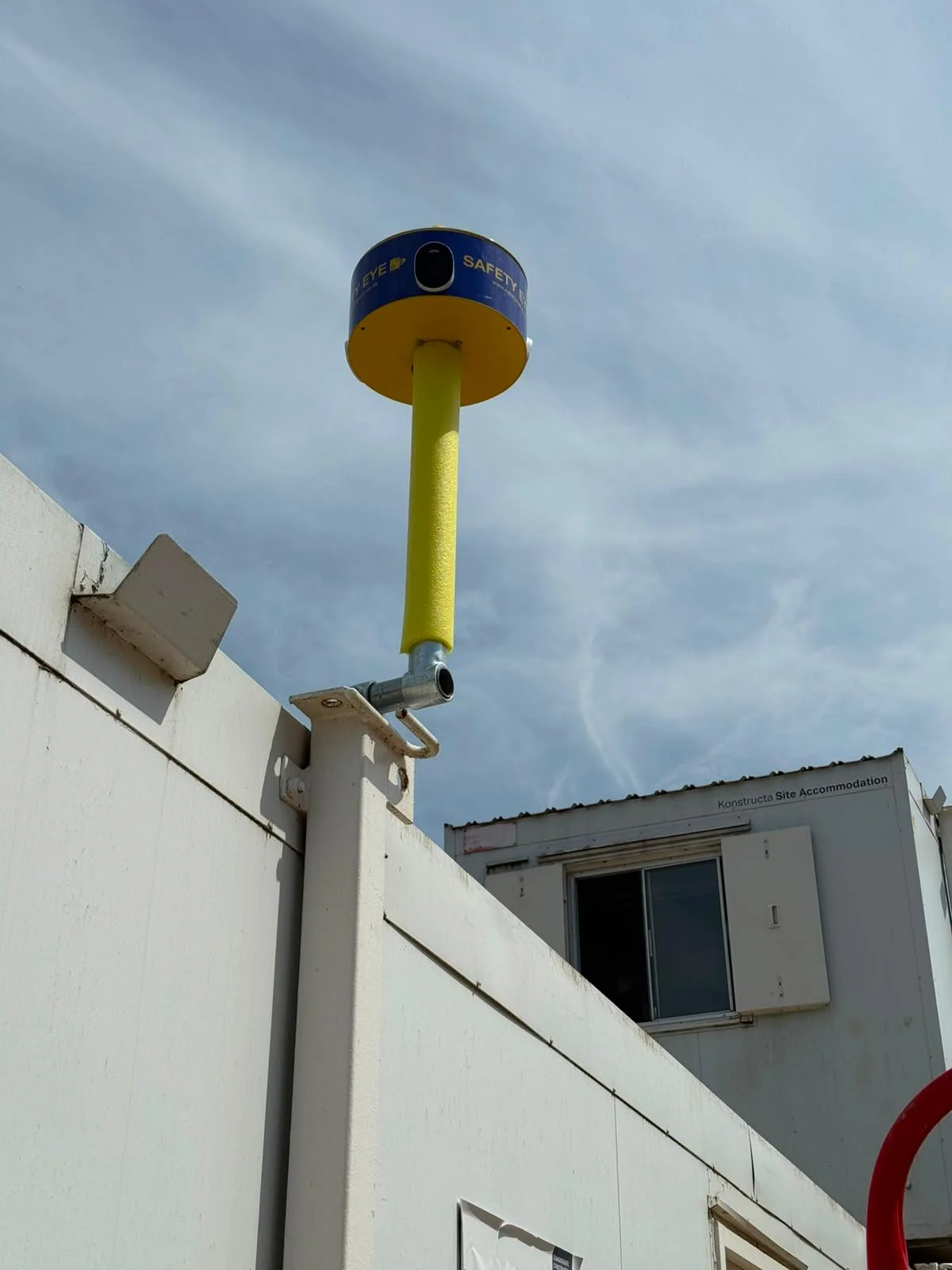 Safety Eye CCTV bollard mounted on site cabin wall for construction site monitoring