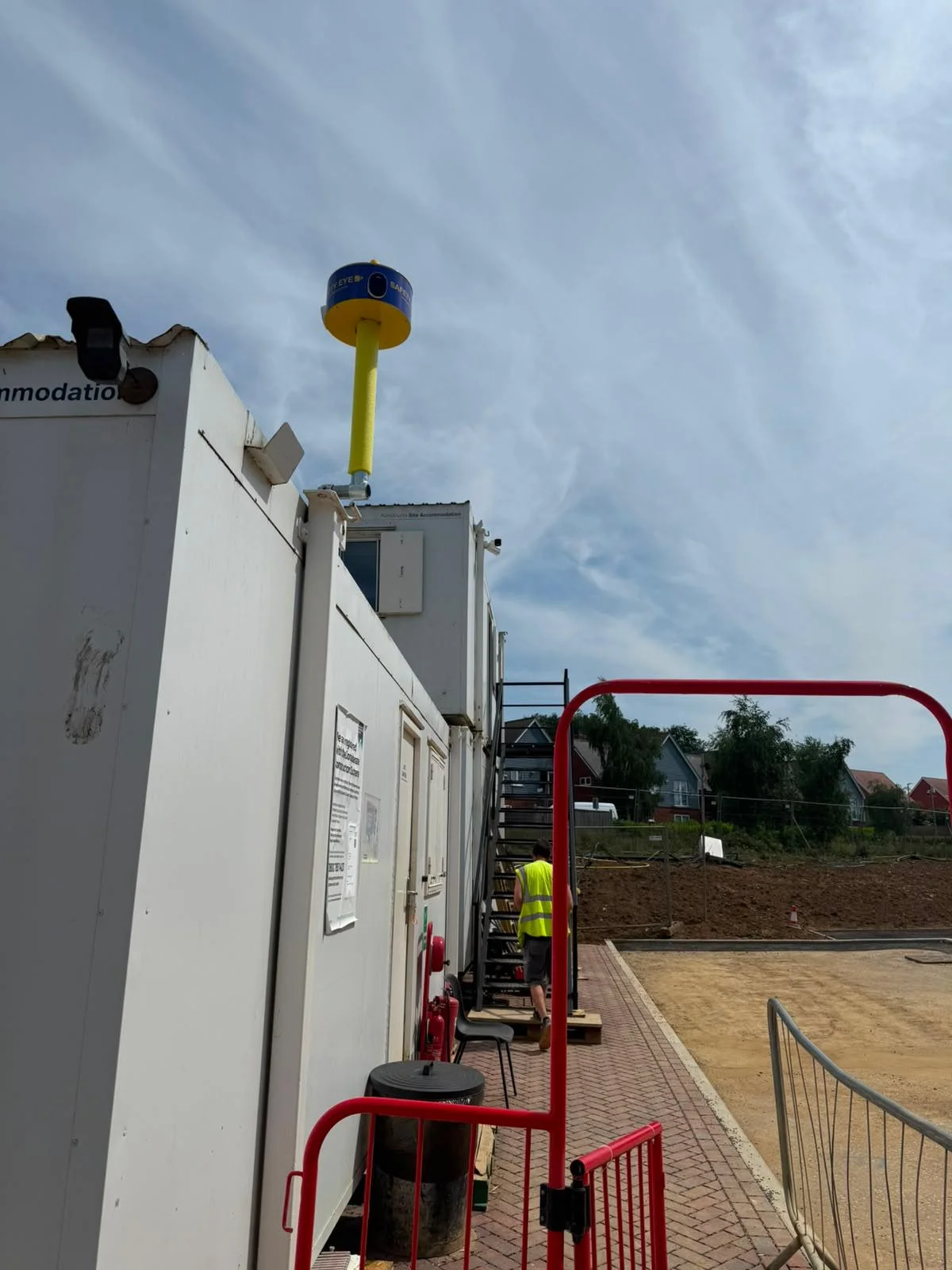 Side view of Safety Eye CCTV bollard mounted on a construction site office cabin