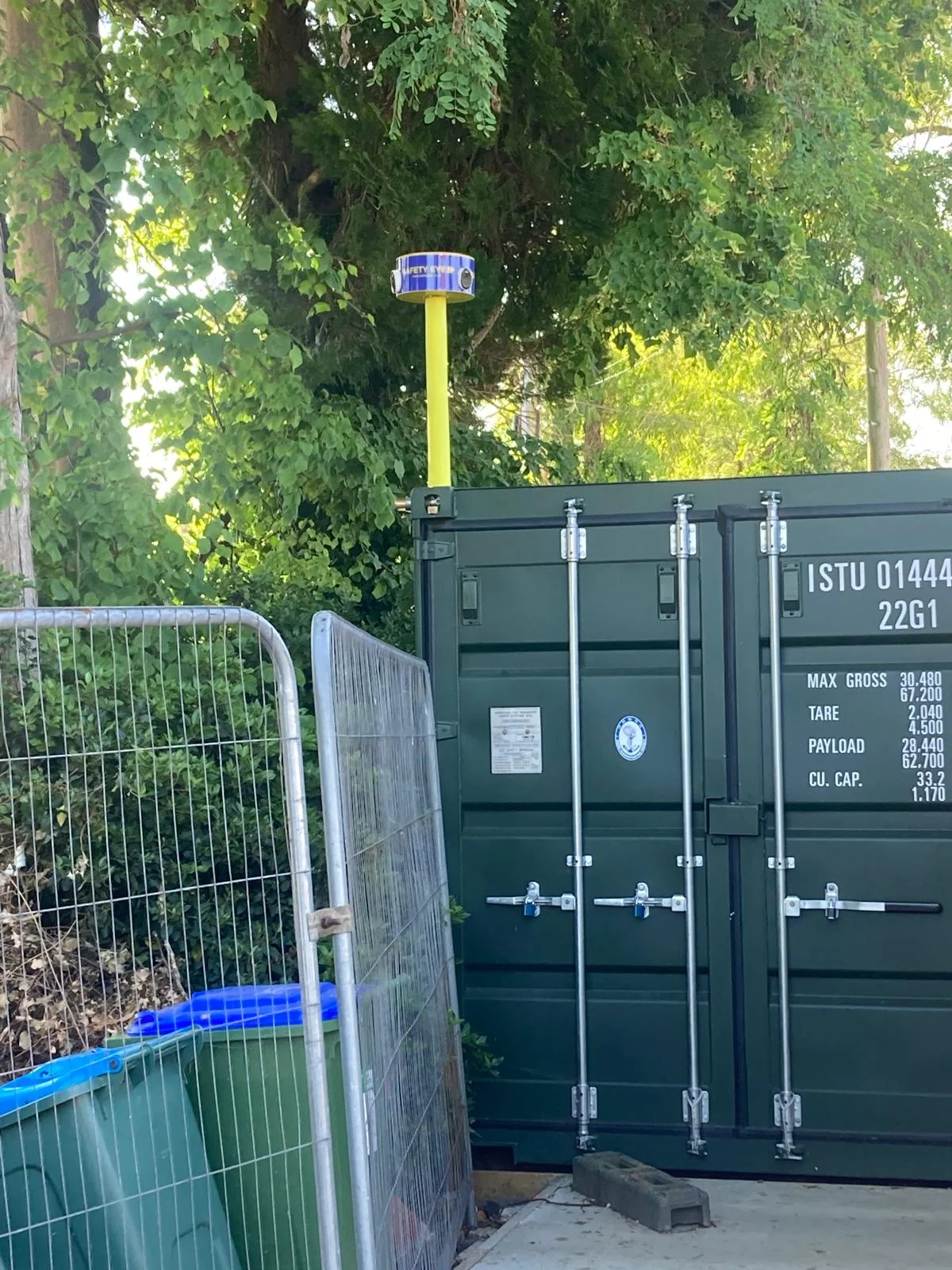Safety Eye mobile CCTV unit protecting a storage container and construction site with Heras fencing